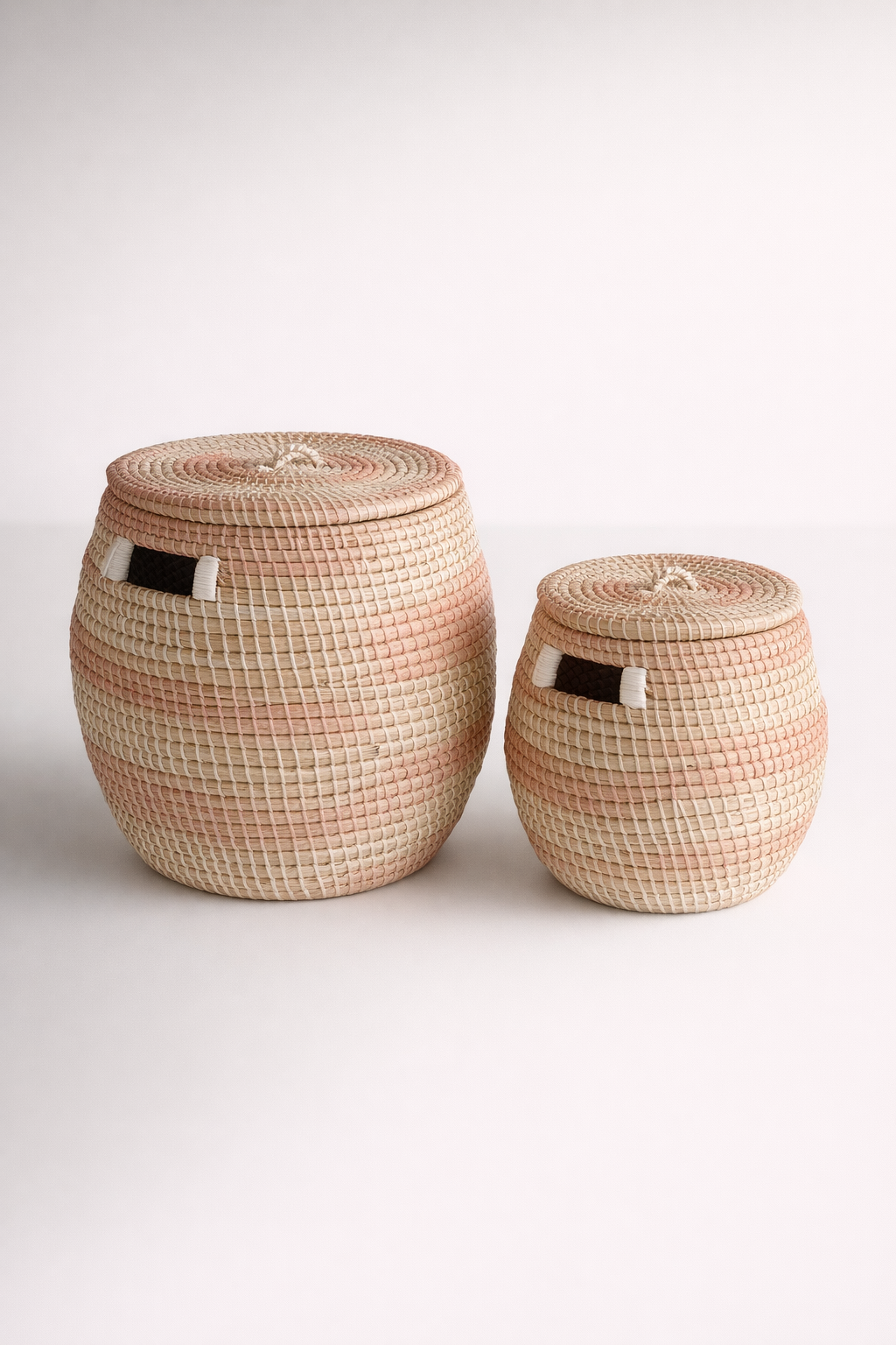 Set Of 2 Round Natural Seagrass & Pink Baskets With Lids