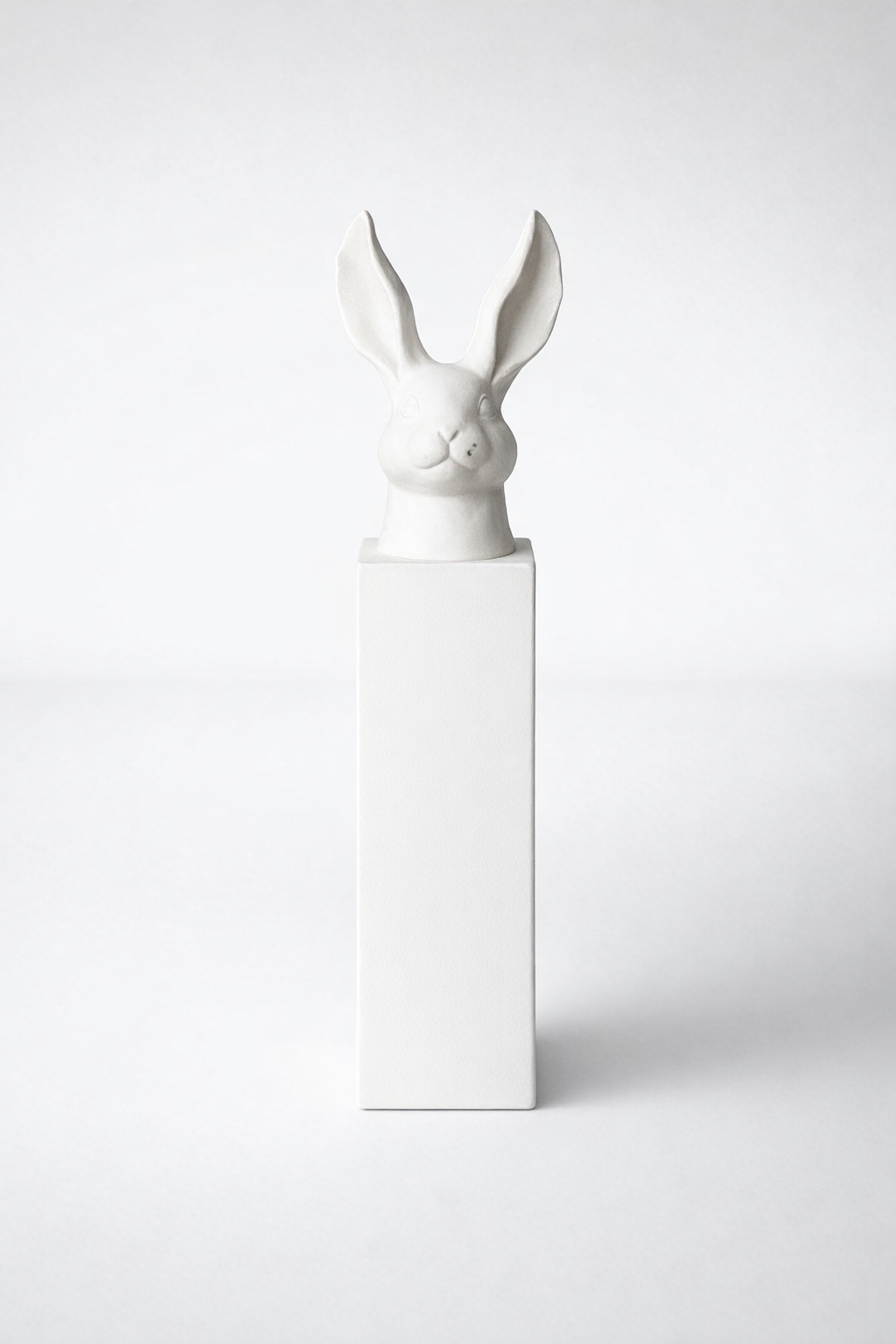 Tall White Bunny Head On Column