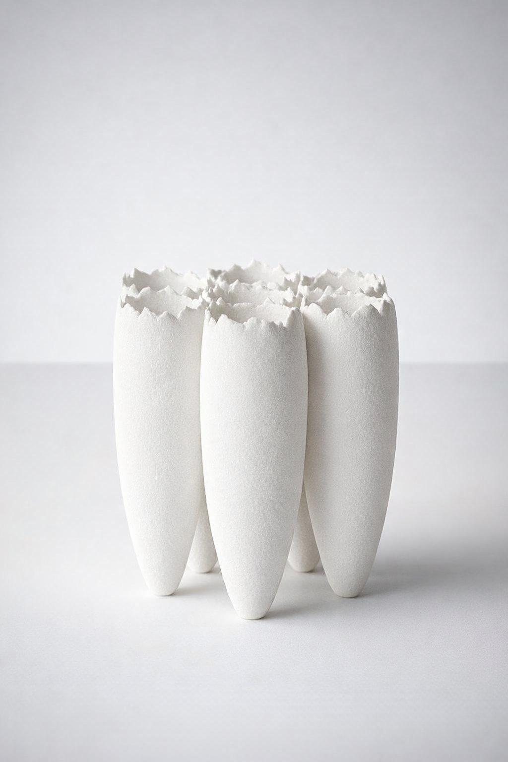 7 White Ceramic Vases Joined
