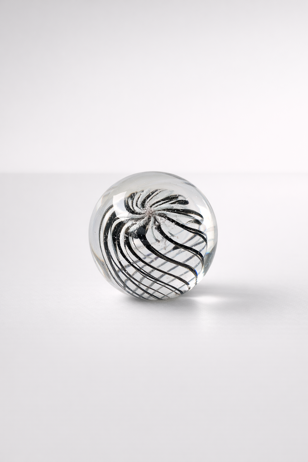 Med. Black & White Whirl Glass Paper Weight