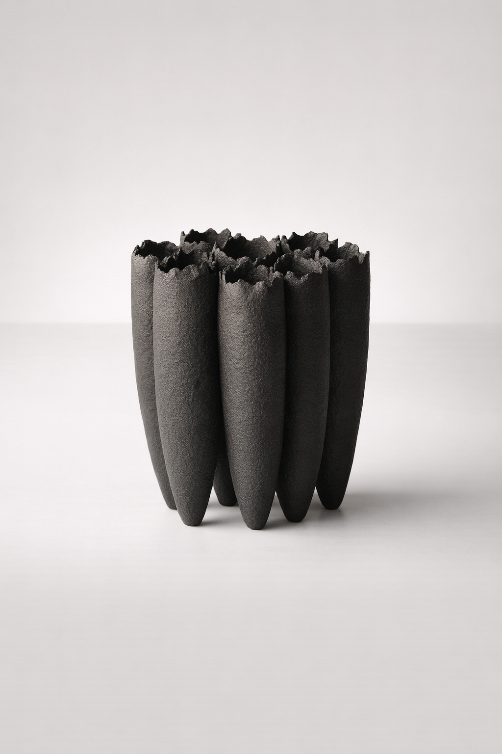 7 Black Ceramic Vases Joined